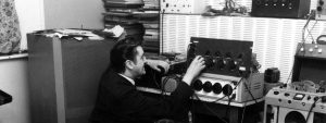 Joe Meek adjusting a knob in recording studio